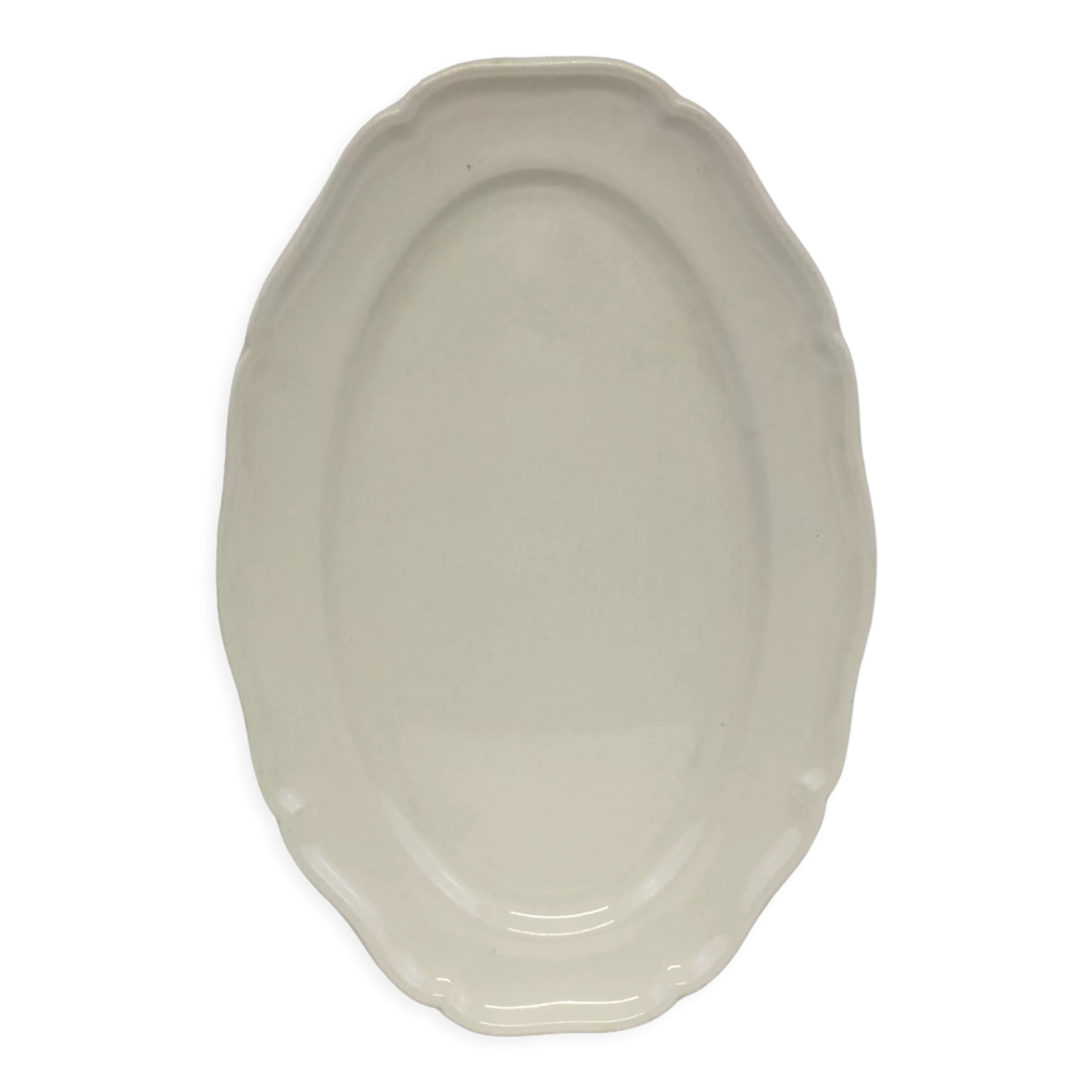 Old ivory-colored, oval-shaped dish with chamfered edge