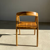 Natural wood chair with wraparound back