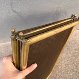 Antique brass fireplace screen from 1920, vintage spark guard.