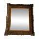 Antique Louis XV style mirror in gilded stucco.