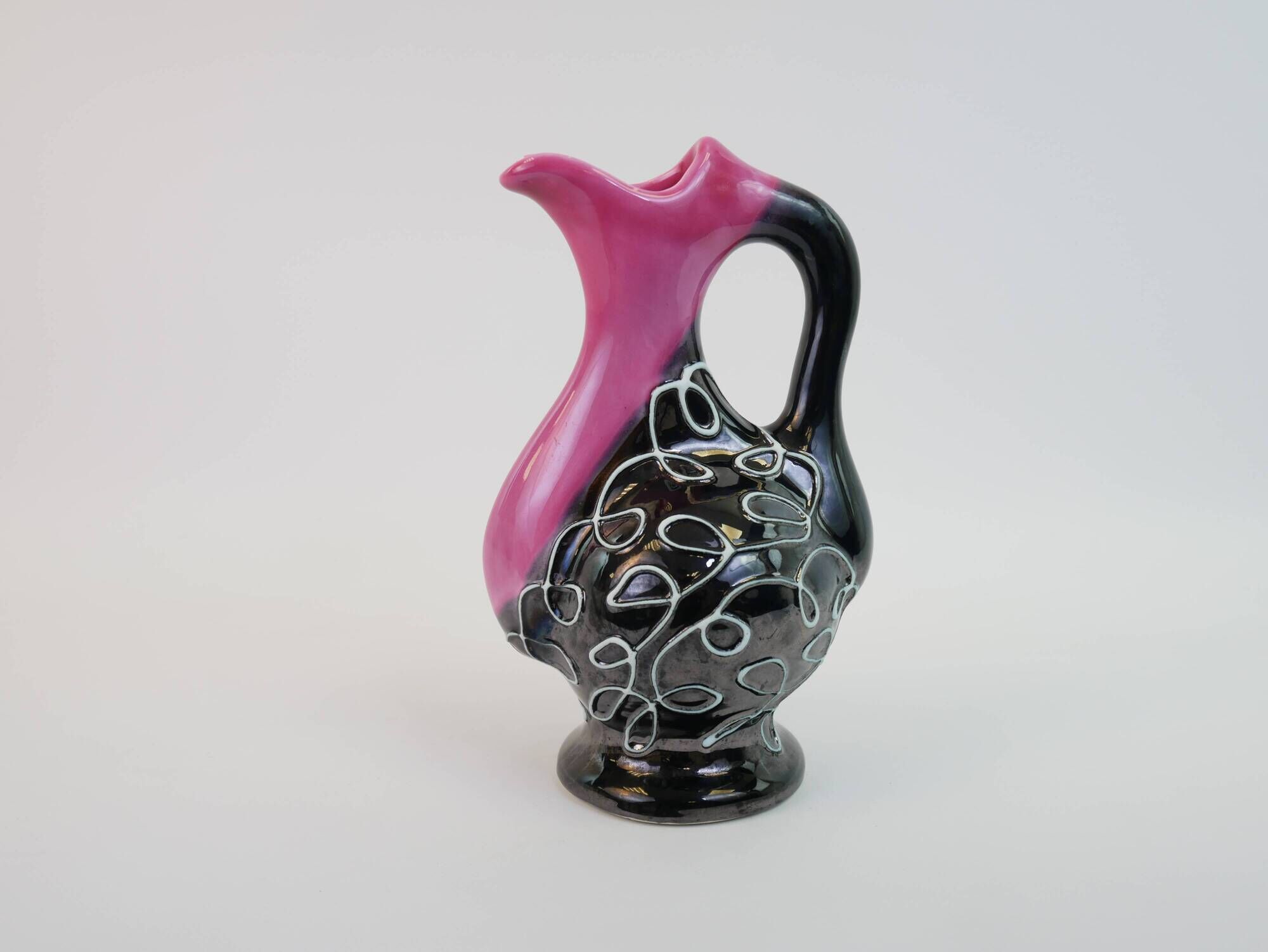 Black and pink Vallauris carafe with white relief patterns