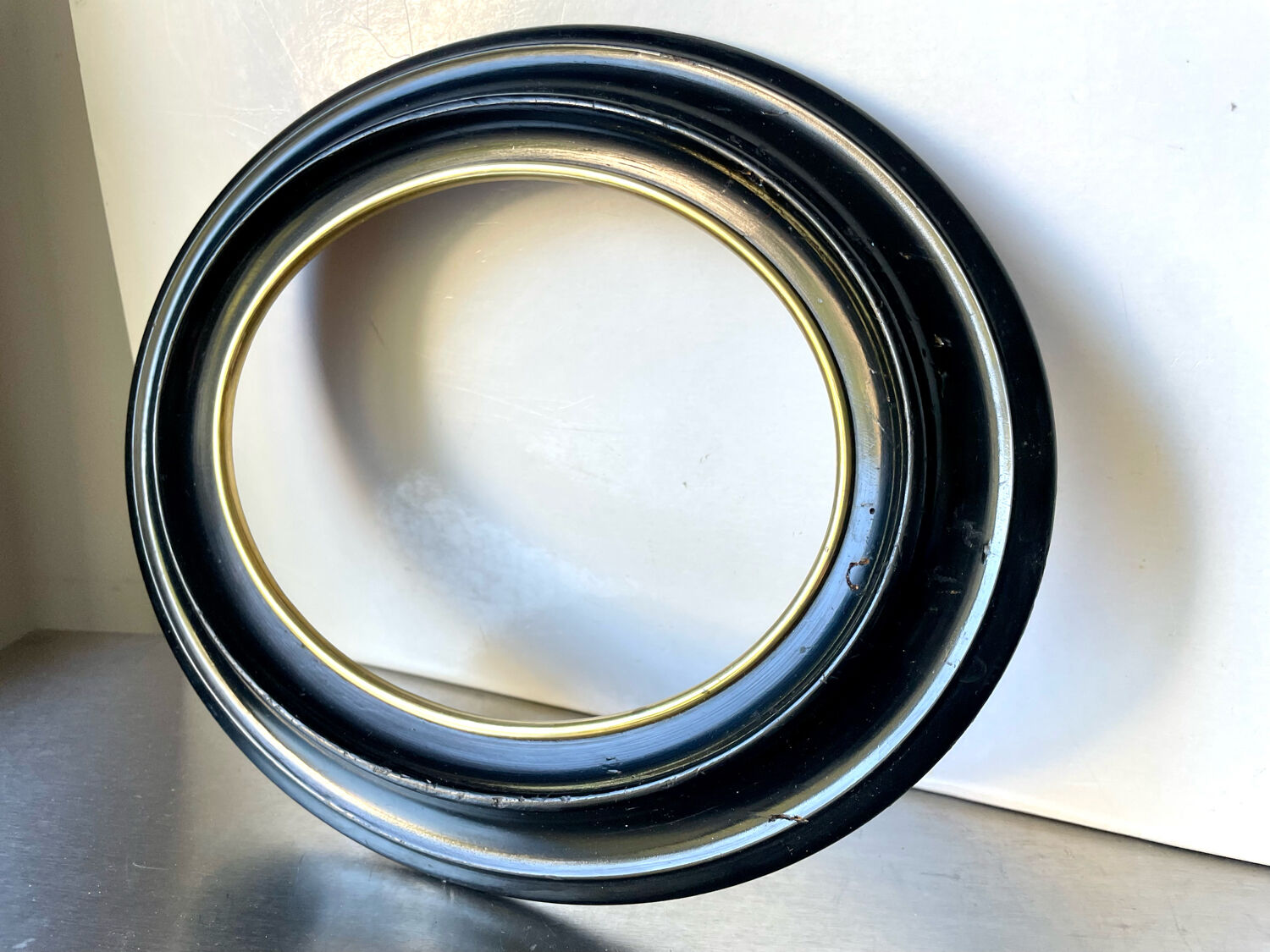 Black wooden oval frame