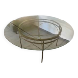 Round table with glass top and ornate metal base