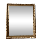 Bevelled mirror in carved gilded wood