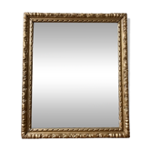 Bevelled mirror in carved gilded wood