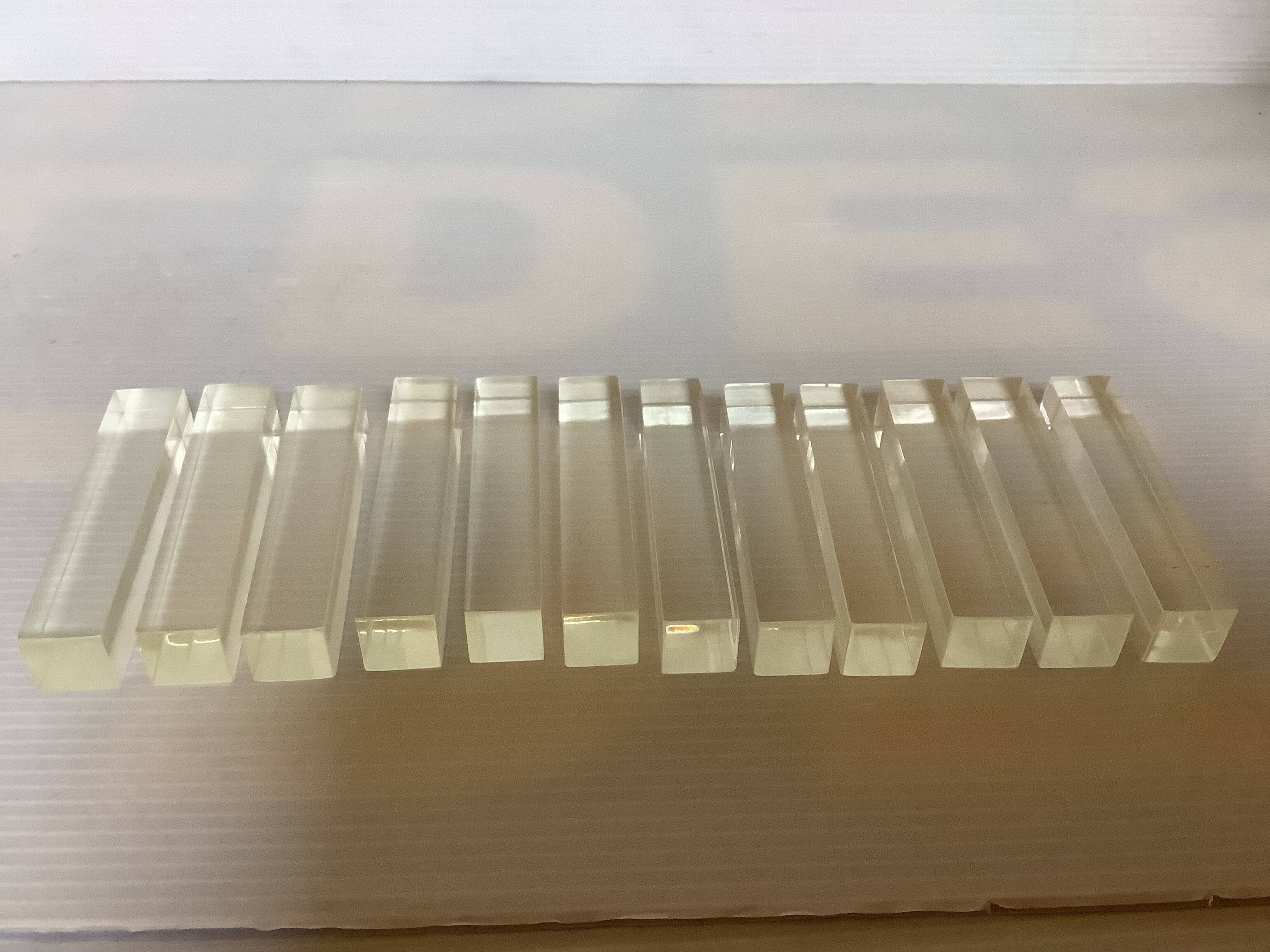 Twelve old lucite knife holders