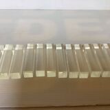 Twelve old lucite knife holders