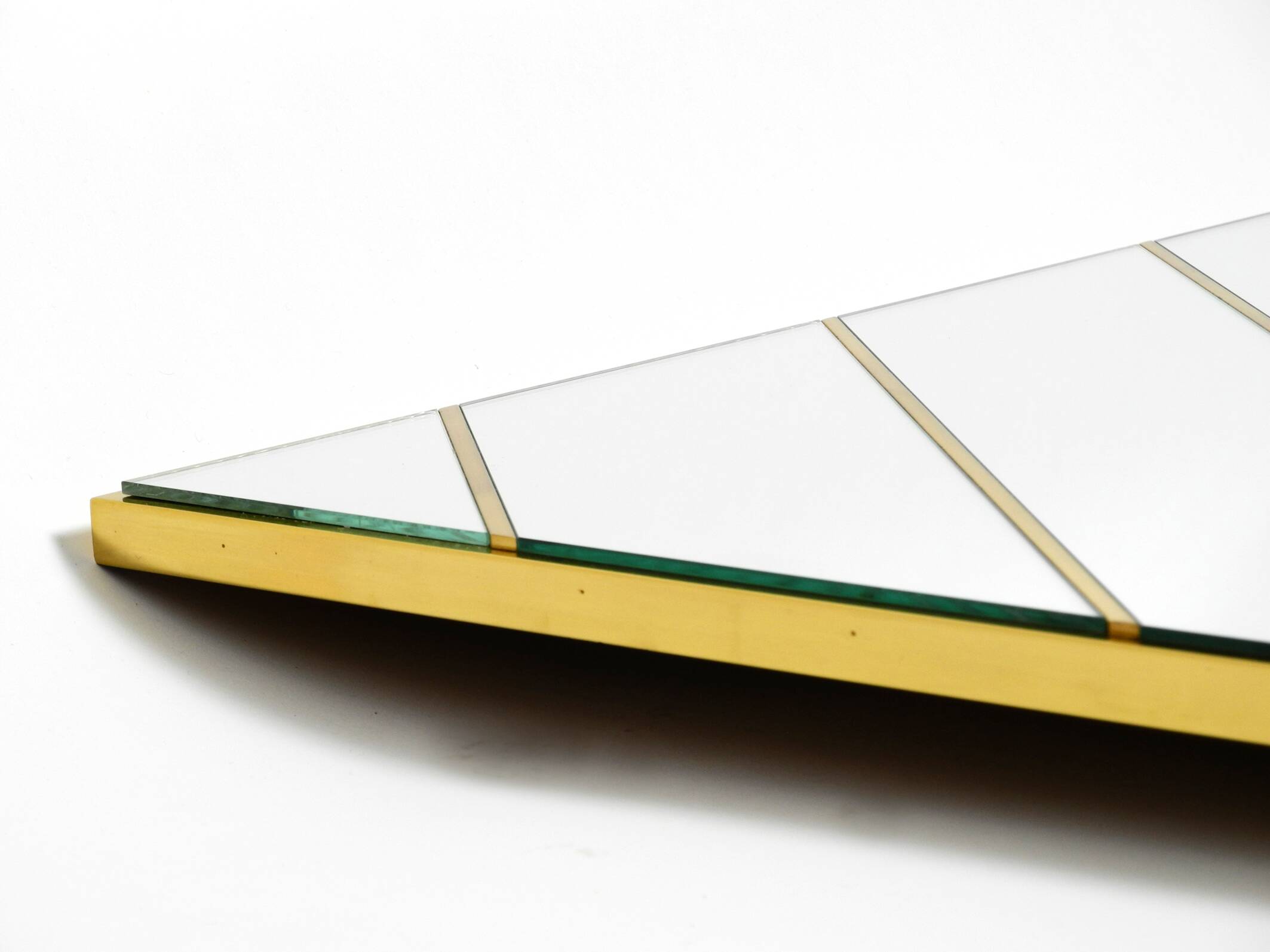 Large, exceptional 1970s brass wall mirror with diagonal mirror strips