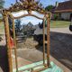 Large closed mirror, 19th century, wood and gilded stucco.