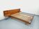 Double bed in vintage Scandinavian style from the 1960s with bedside tables in teak.