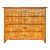 Large antique Biedermeier-style chest of drawers with wood grain.