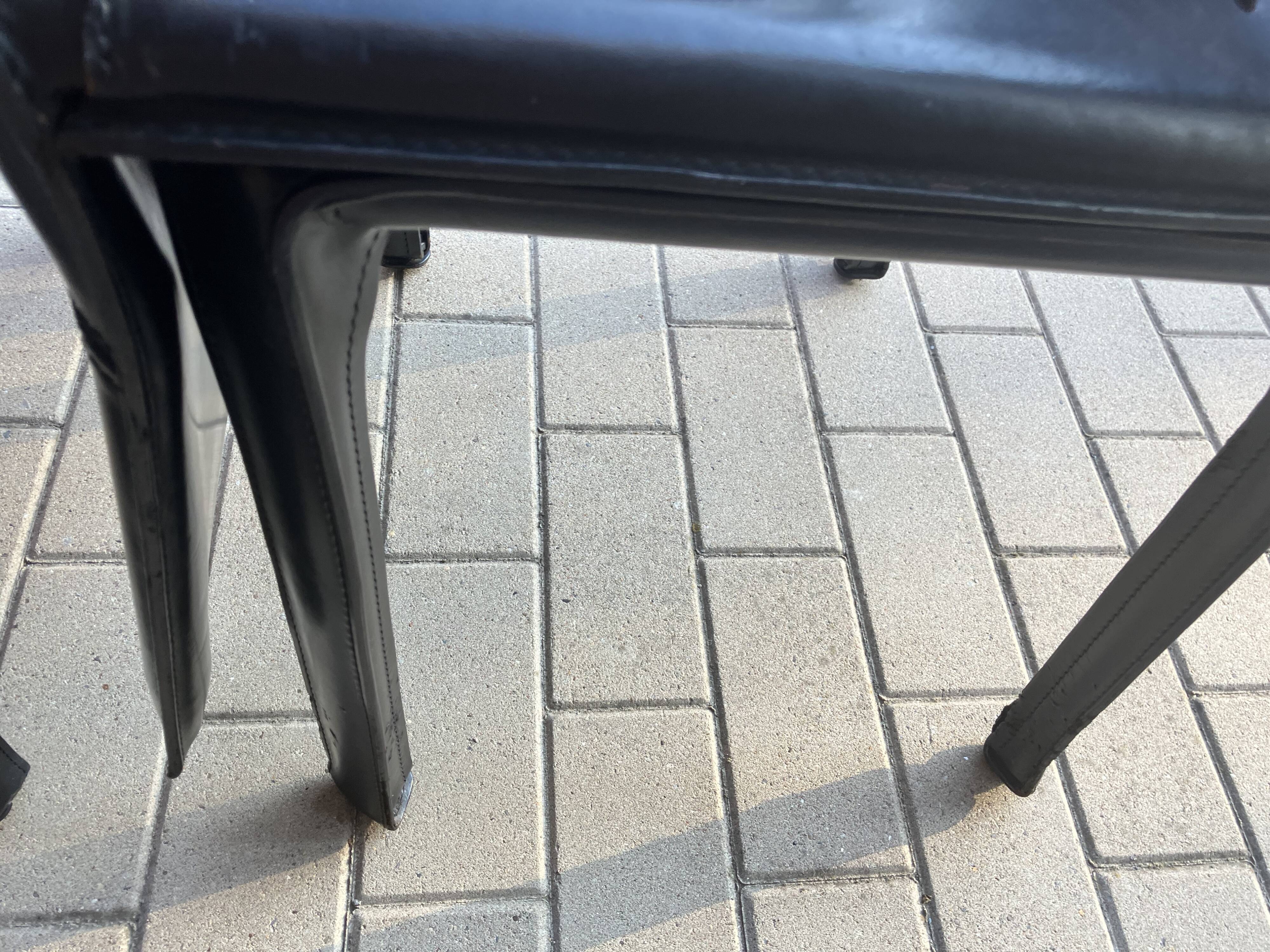 4 black Cassina Cab chairs by Mario Bellini
