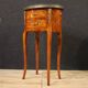 Pair of oval bedside tables in marquetry from the 20th century.
