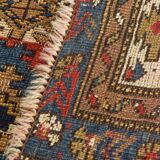 Antique tissé à la main - Tapis persan à fond bleu avec des figures ressemblant à des oiseaux