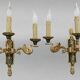 Pair of gold bronze wall lights in Empire style with three lights "Lucien Gau"
