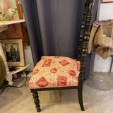Fireplace or changing chair period 1900 in black lacquered wood and printed fabric