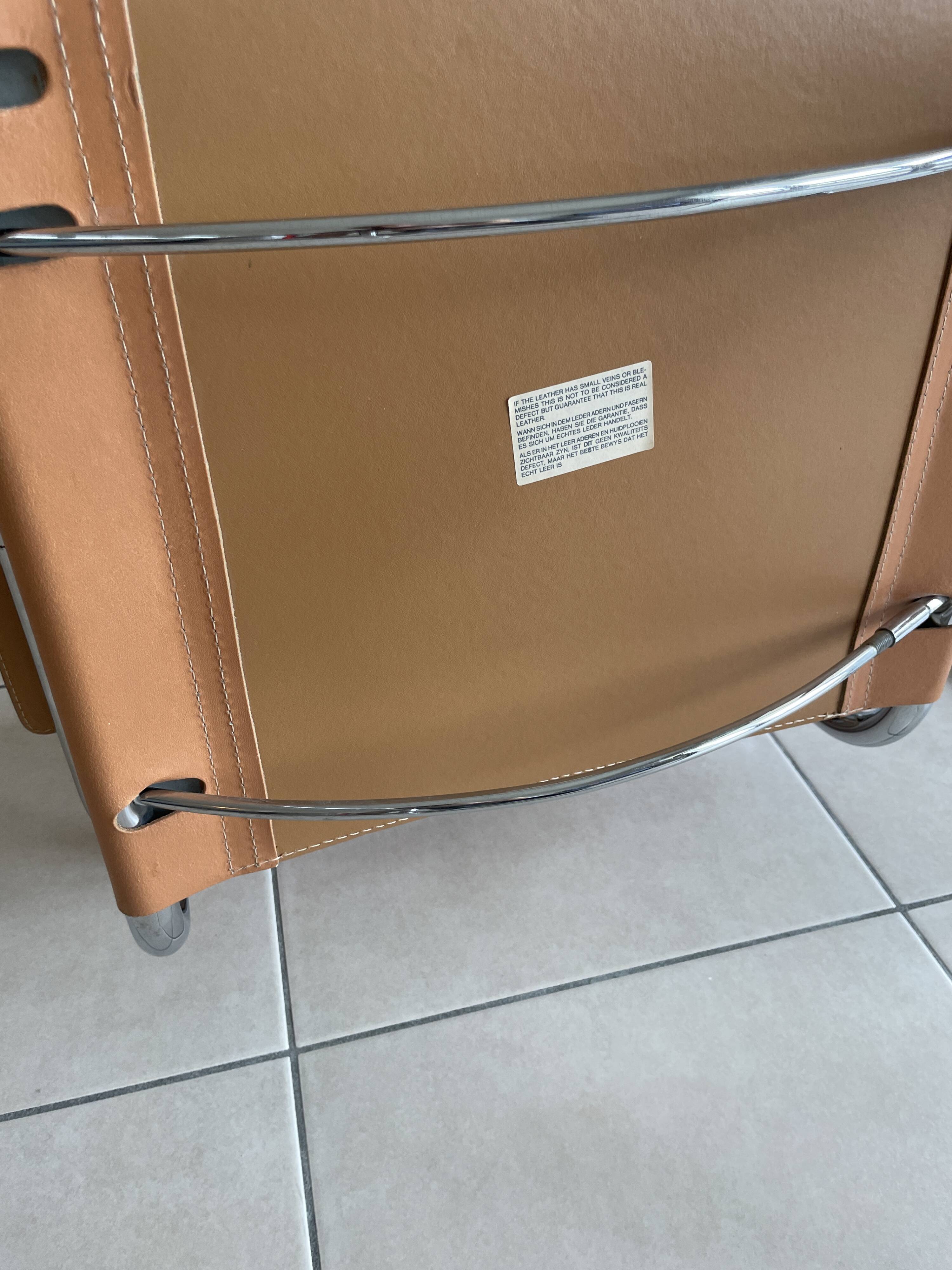 Stainless steel & leather armchairs