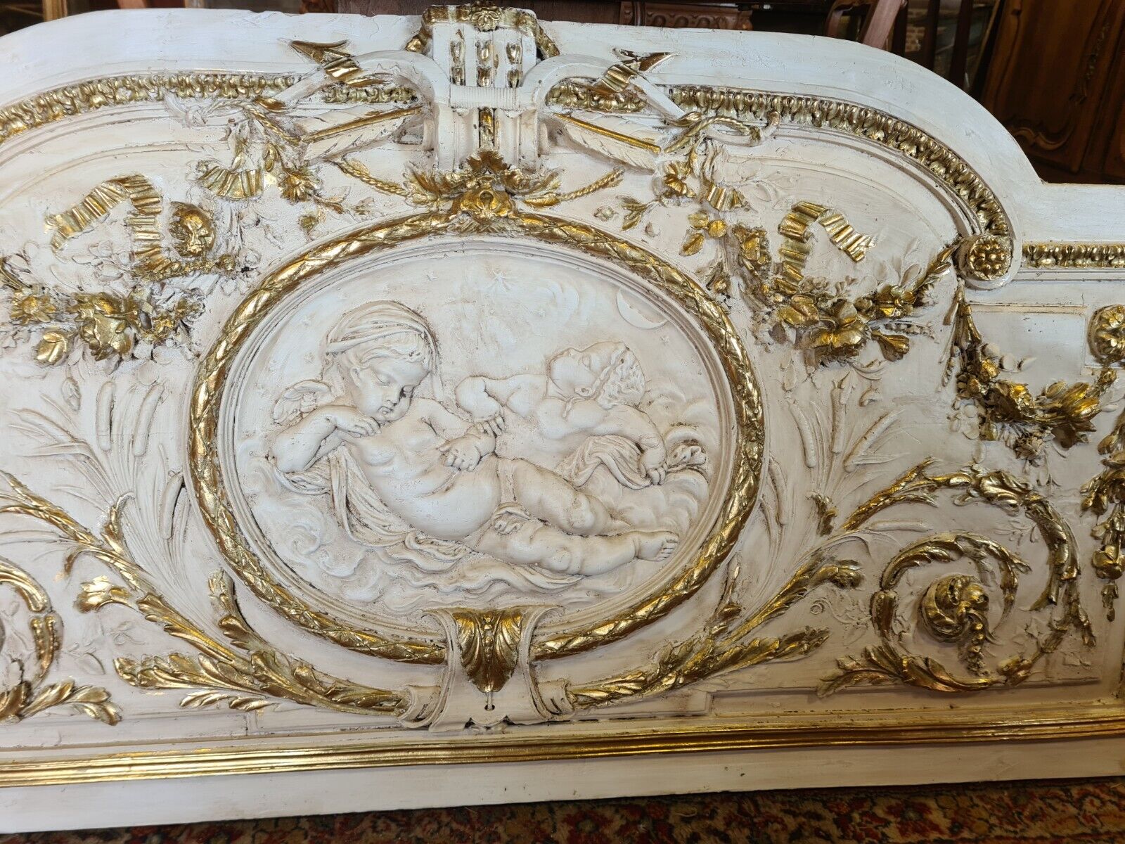 Pediment panel with stucco and wood angels