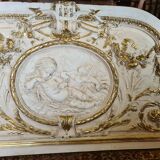 Pediment panel with stucco and wood angels