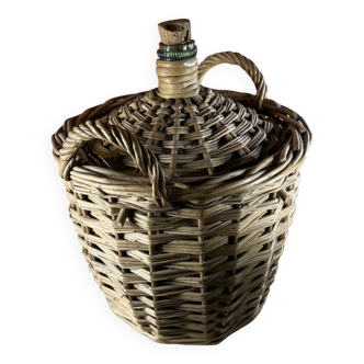 Vintage demijohn with rattan carboy