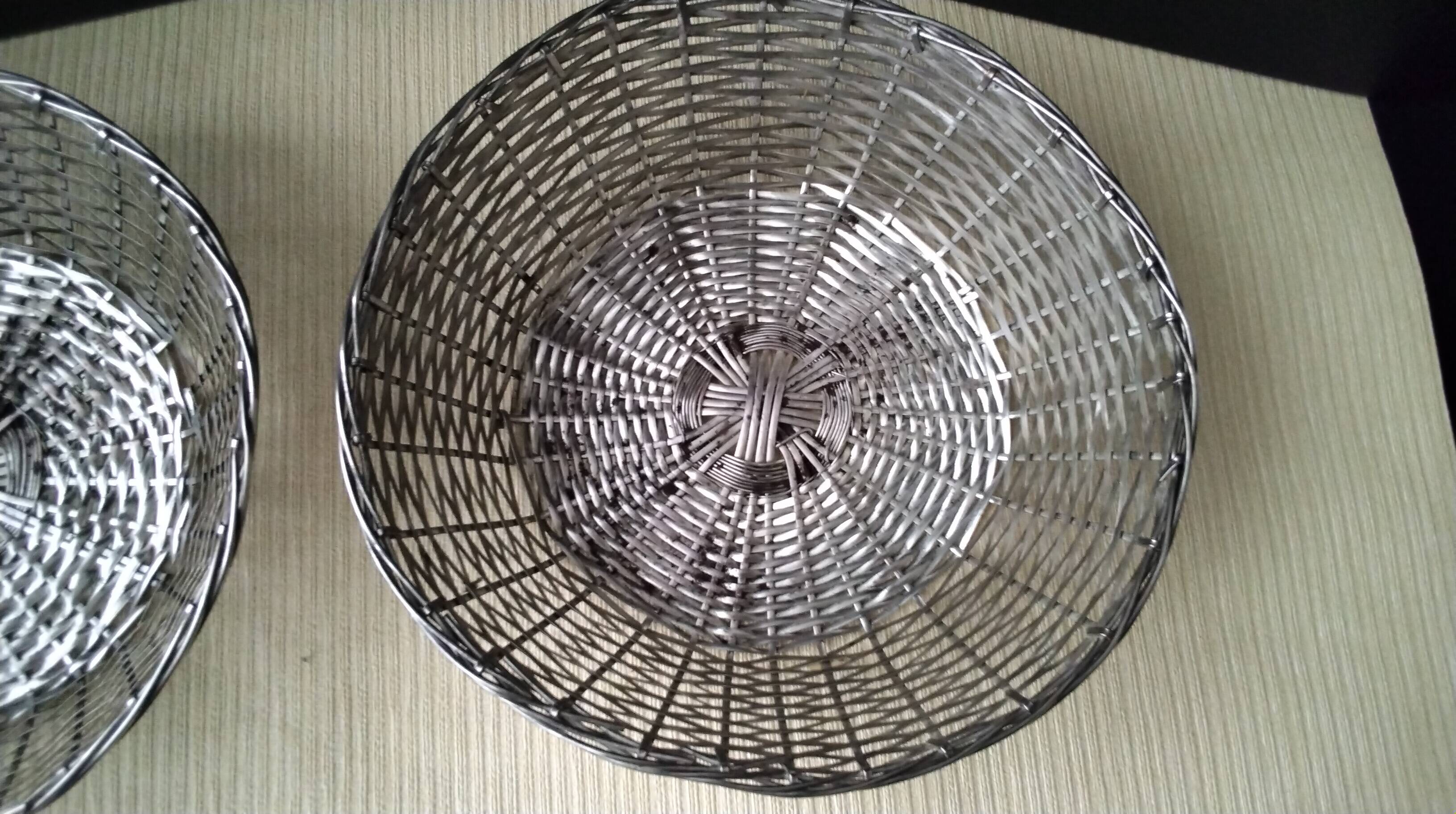 Pair of bread baskets, woven silver-plated wire baskets