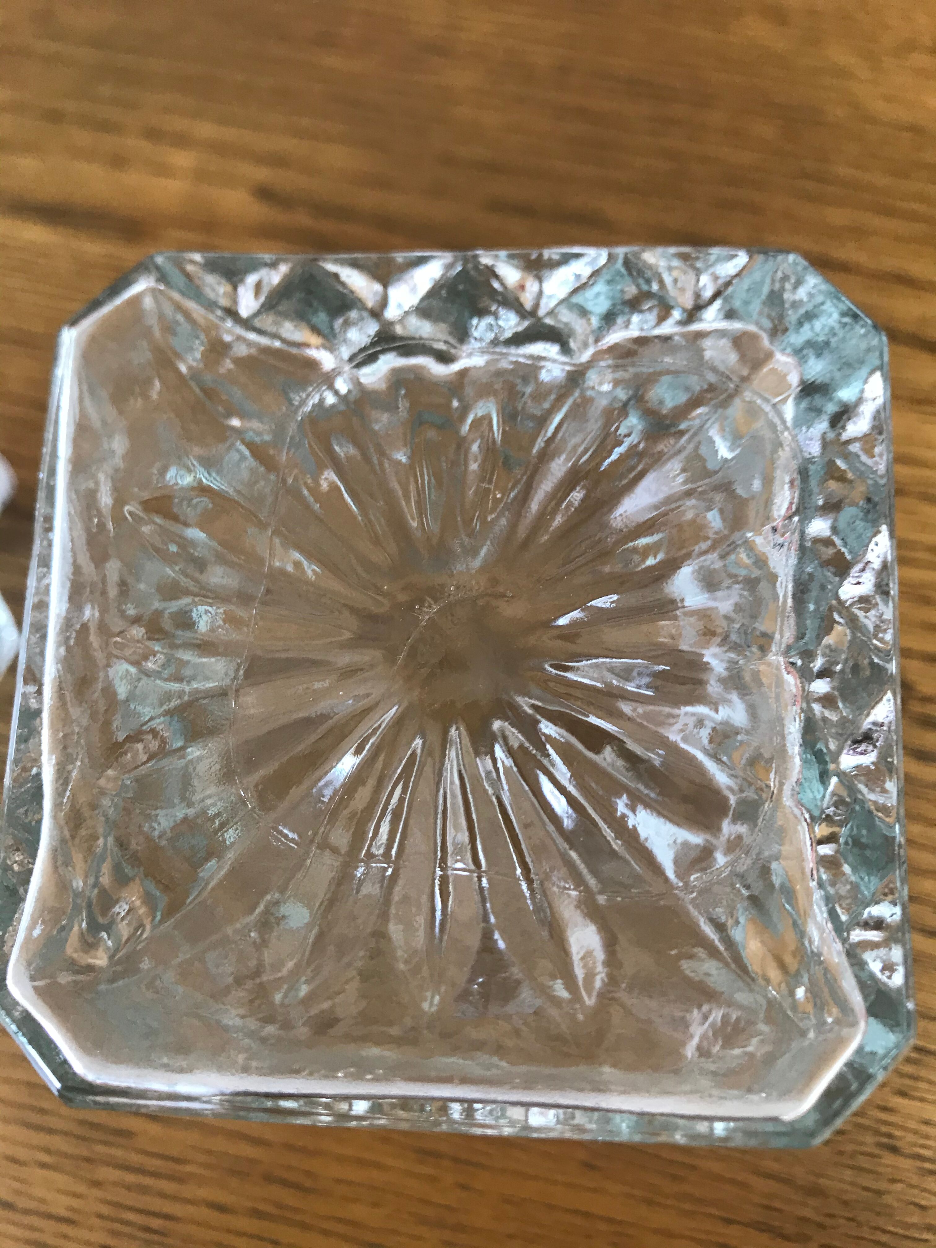 Mismatched decanter and whiskey glasses