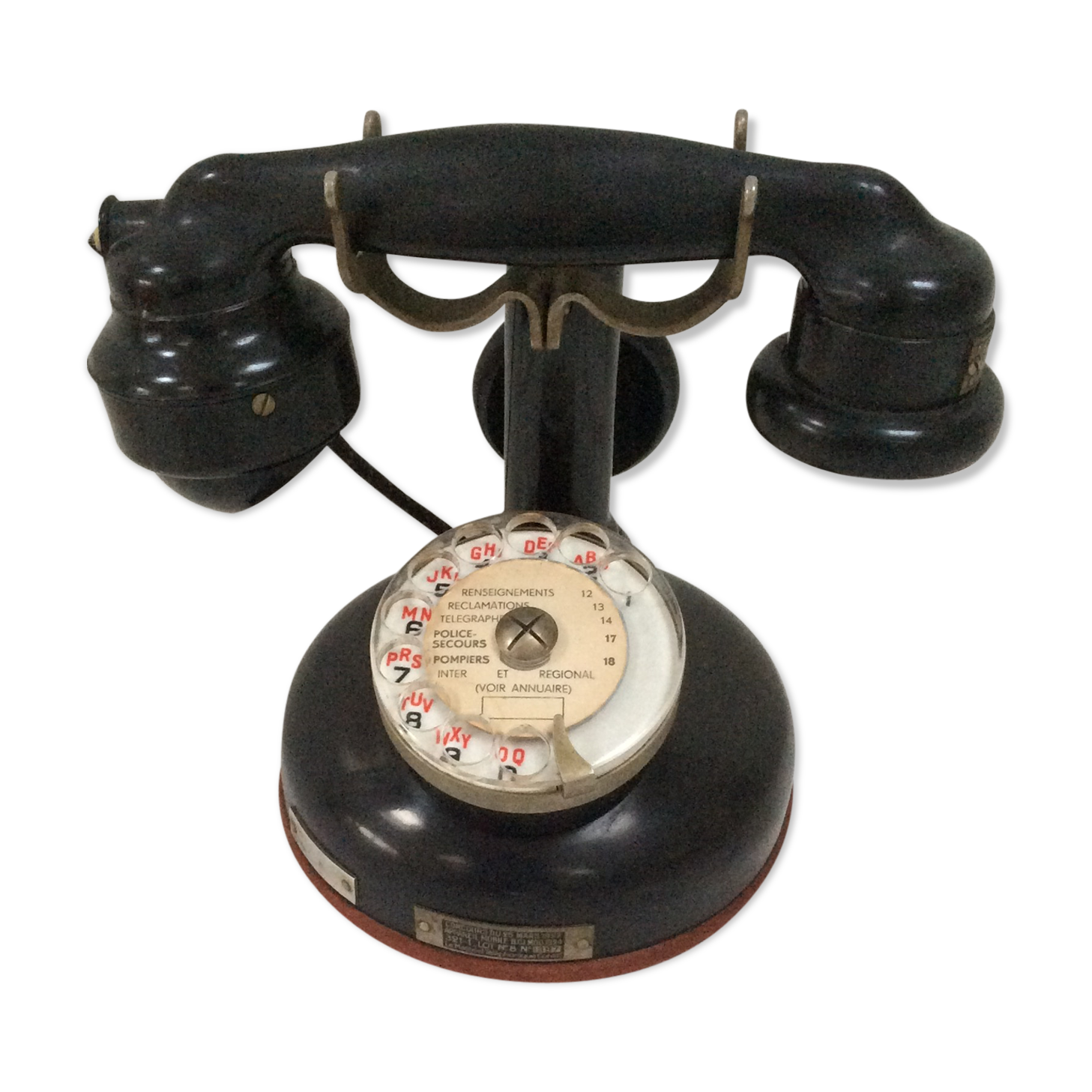 Old Bakelite telephone with column