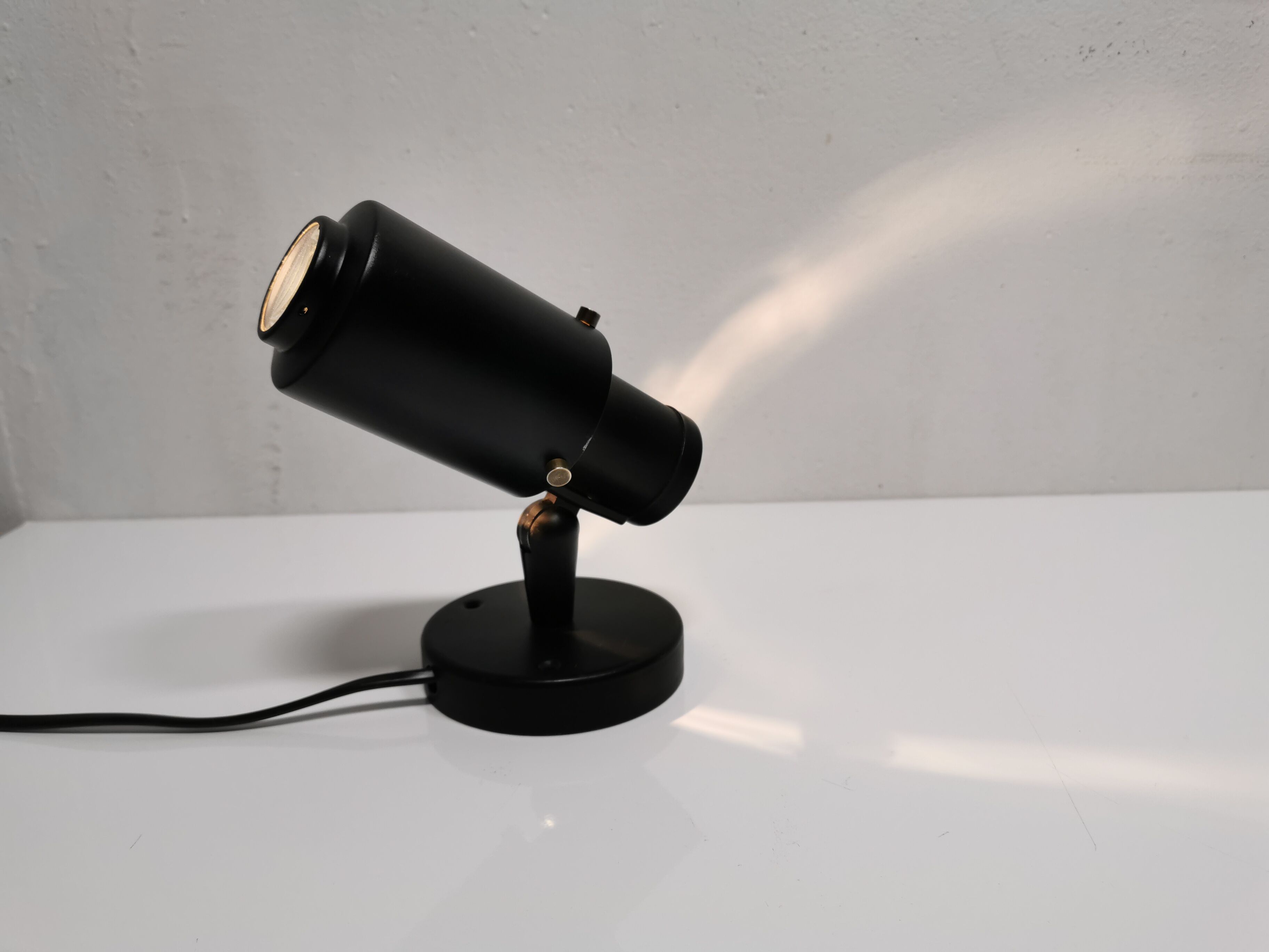 Jacques Biny's black zodiac sconce for Lita