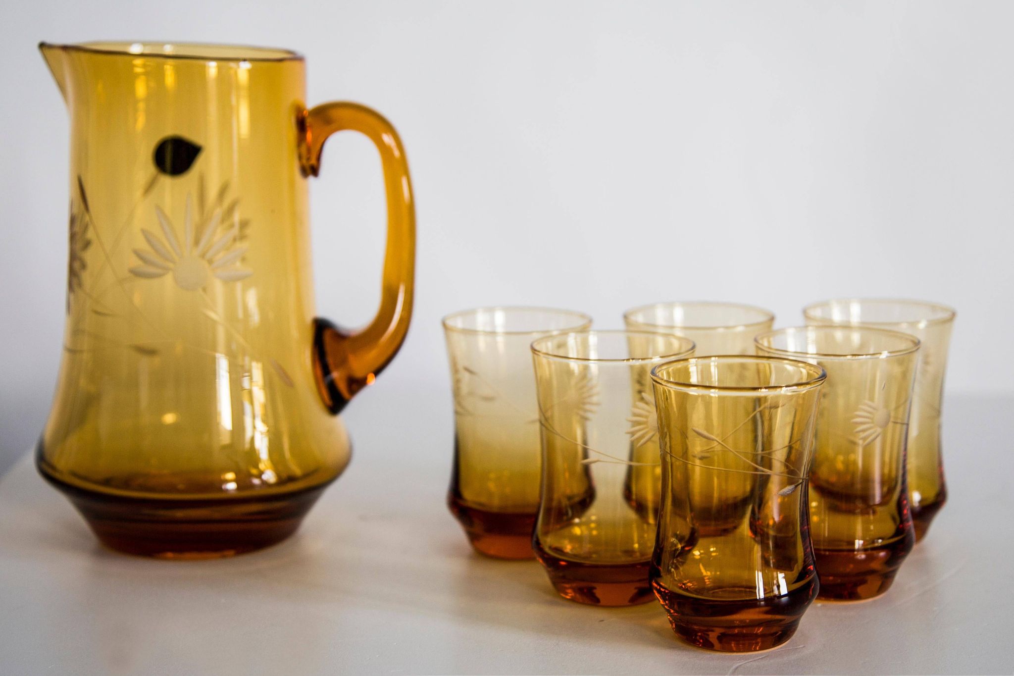 Set of six mid-century glasses and yellow Murano pot, Europe, 1960s.