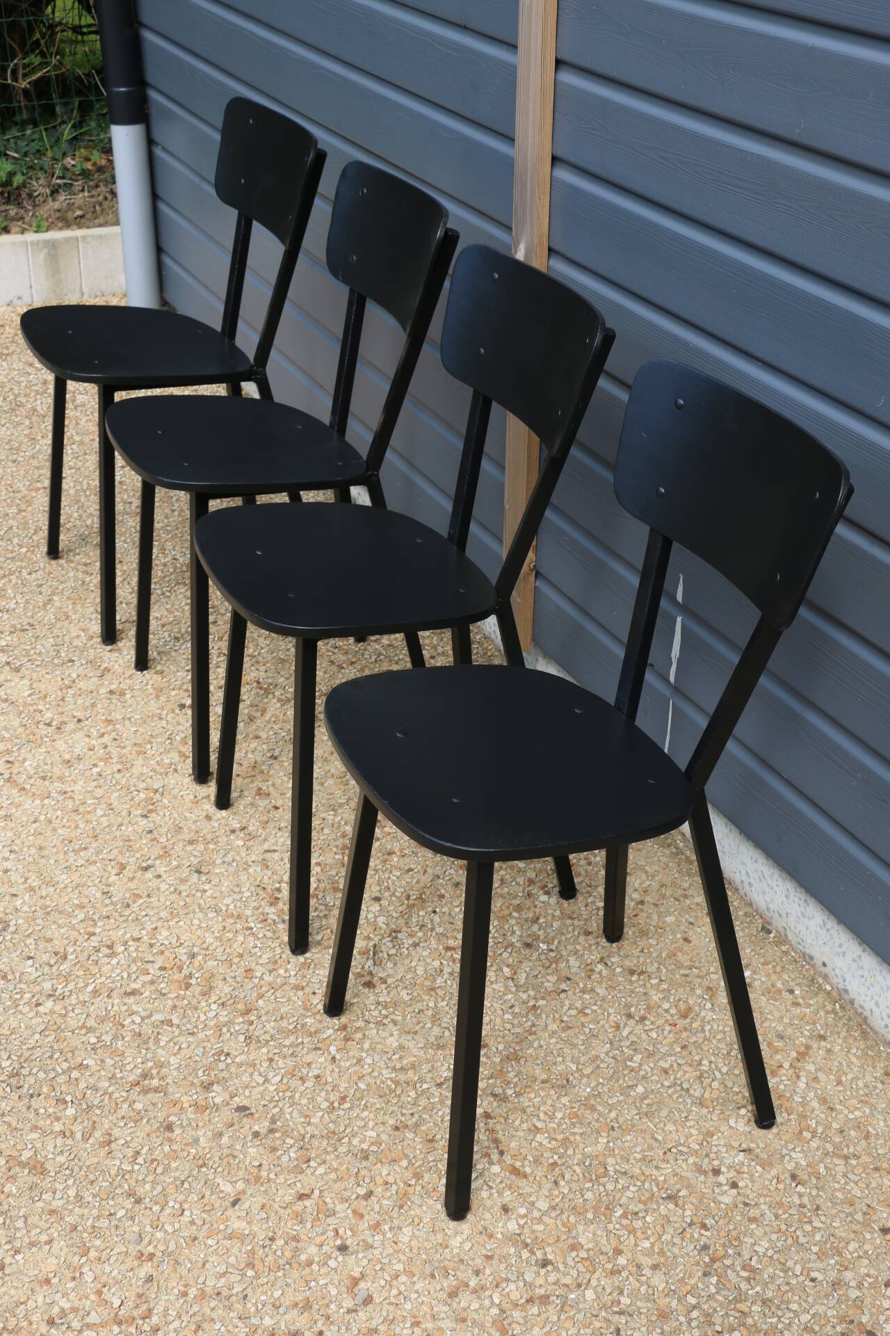 4 black metal and wood chairs