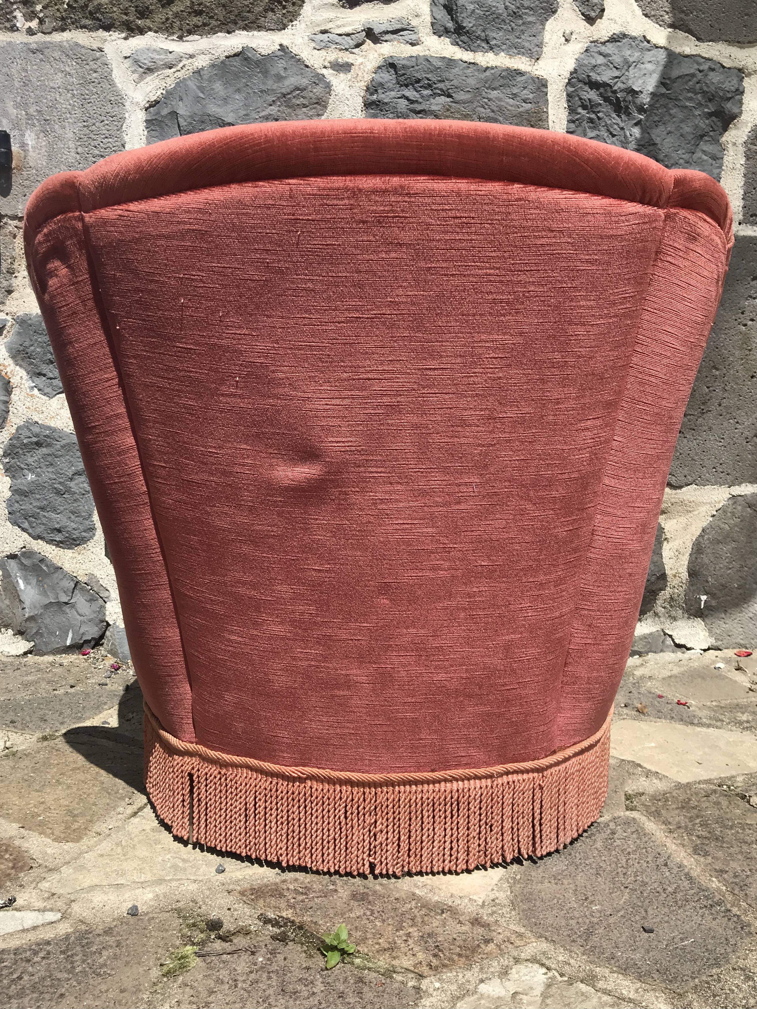 Vintage pink velvet armchair with fringes