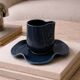 Set of wavy ceramic cup and saucer - petrol blue