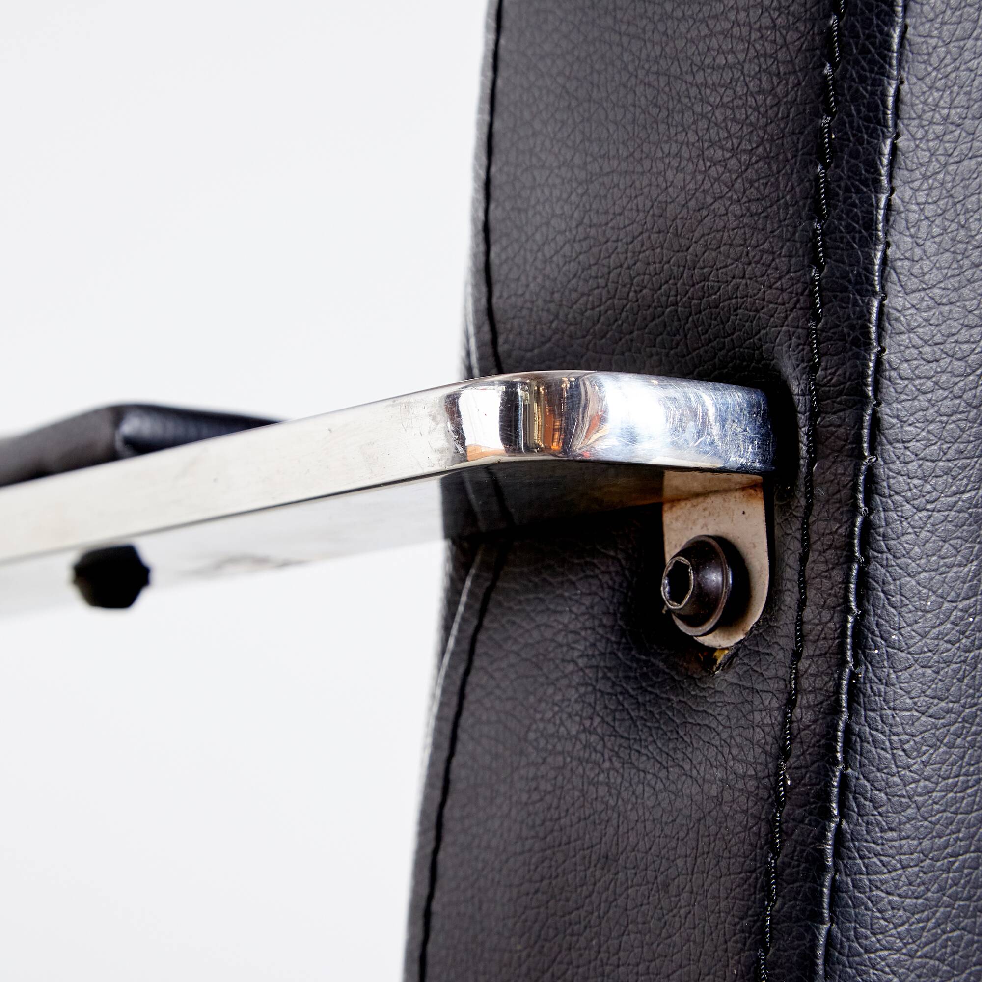 Steel armchair with leather upholstery