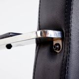 Steel armchair with leather upholstery