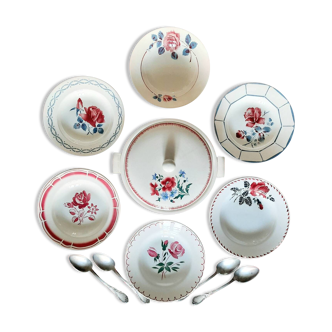 Old mismatched earthenware soup plates accompanied by a soup tureen