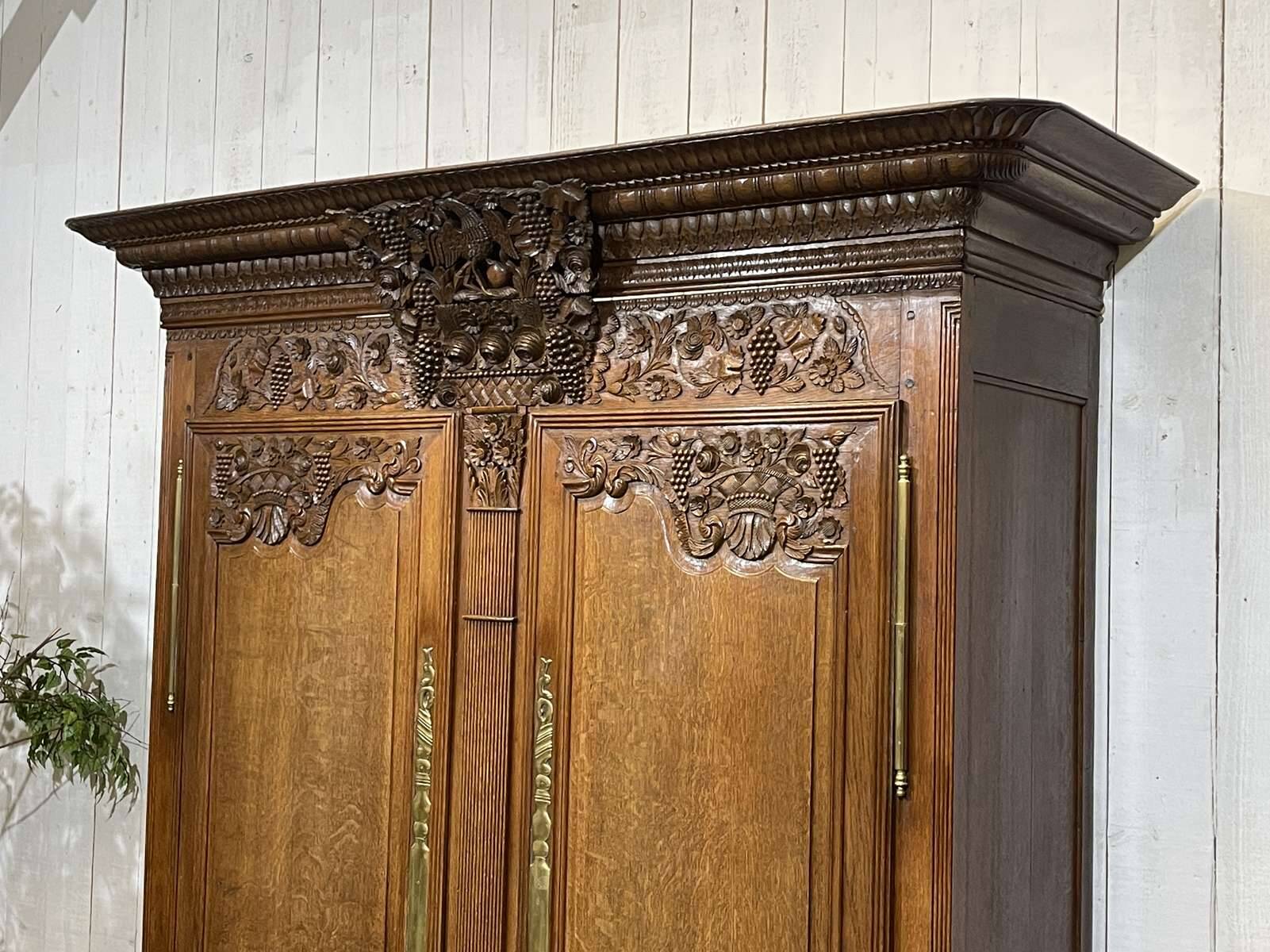 19th-century Norman wedding armoire in blonde oak.