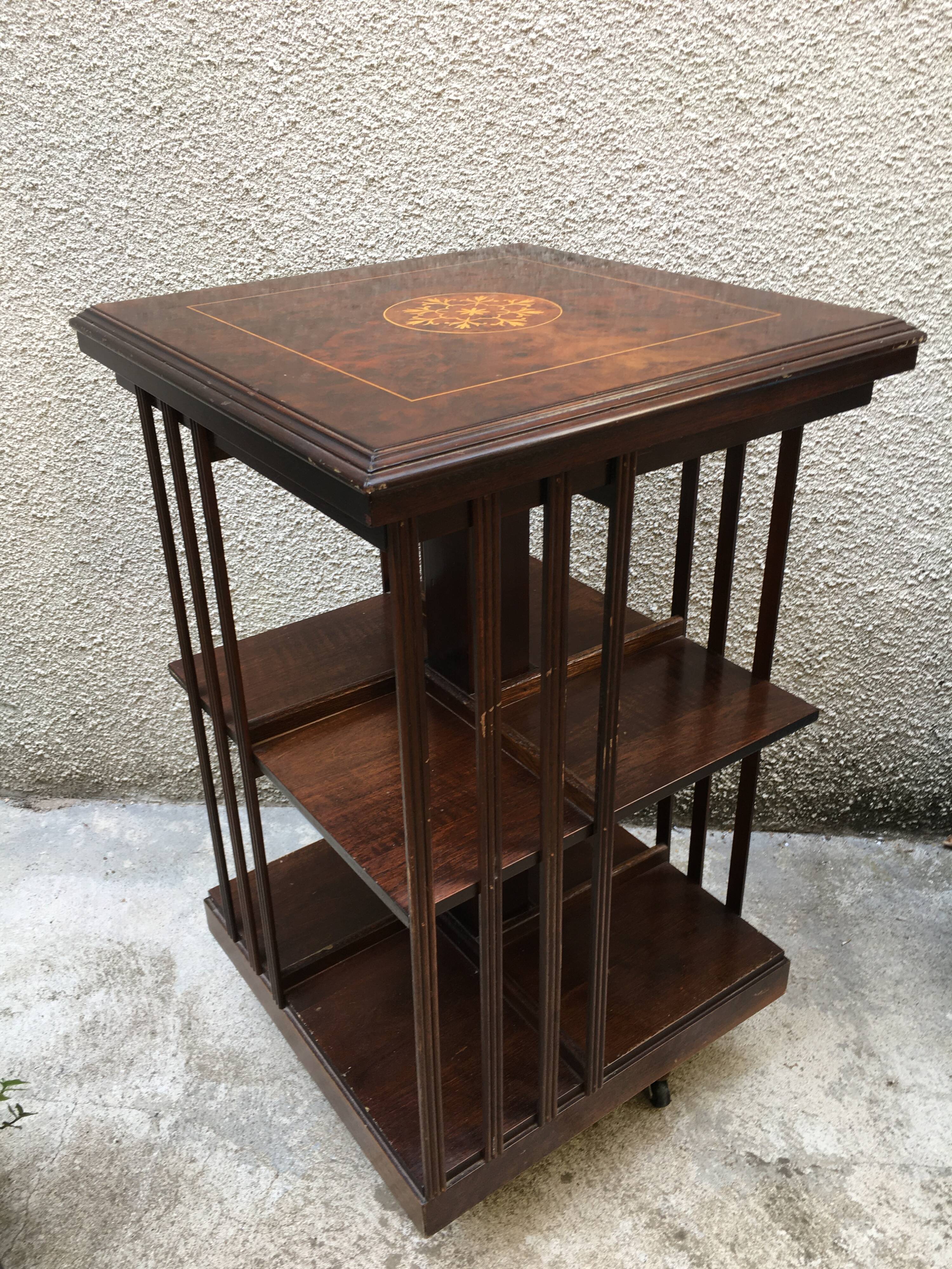 Revolving english library in mahogany, wheeled footing