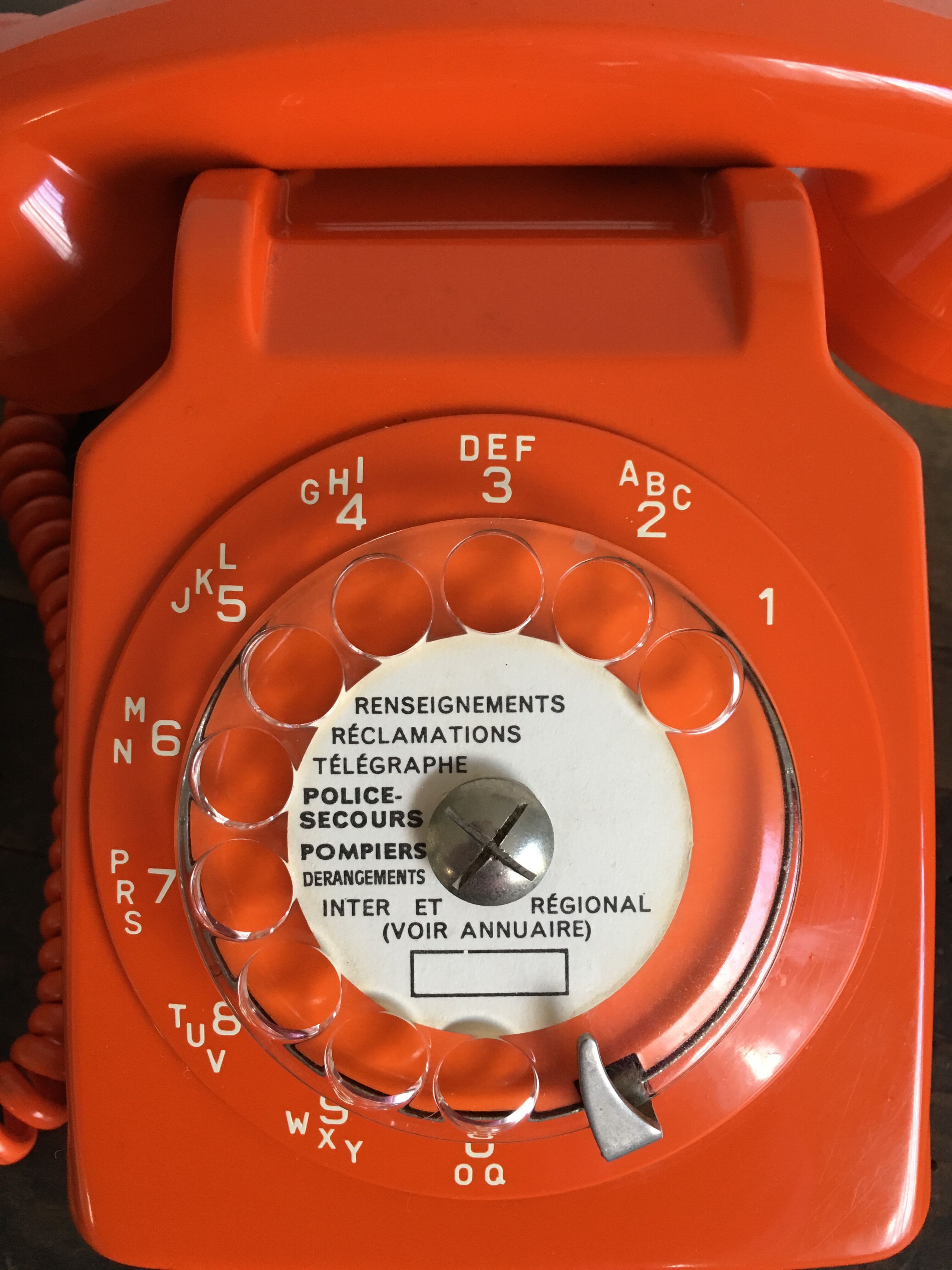 Orange vintage dial phone