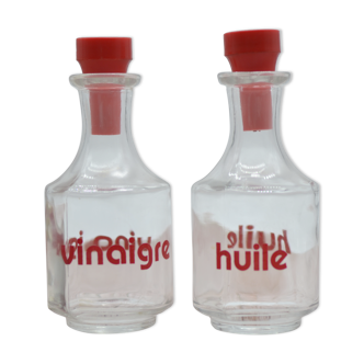 Oil and vinegar with red writing