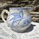 Earthenware pitcher decorated with birds.