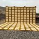 Very large Moroccan Berber rug in ecru and camel 400x300 cm with a grid pattern.