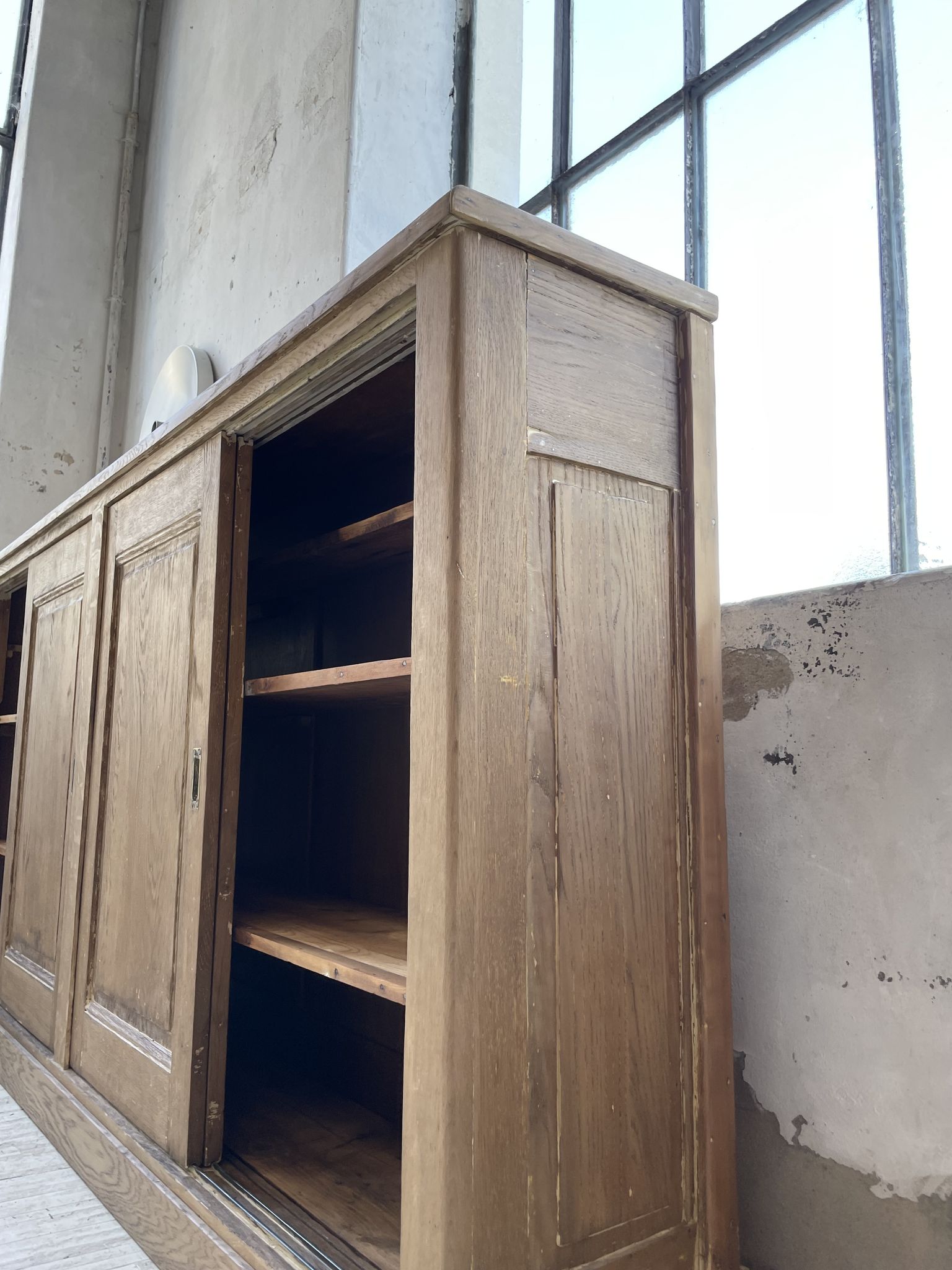 Large row of solid oak loom sliding doors