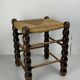 Brutalist wood turned bobbin rush stool in the style of Charles Dudouyt