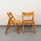 Pair of vintage folding chairs in pine from the 70s and 80s.