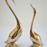 Pair of stylized birds in solid brass