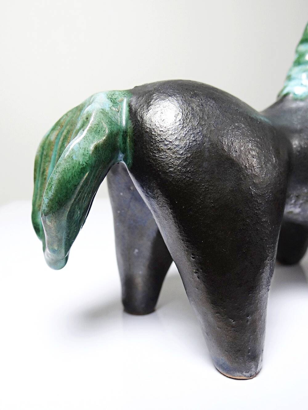 Stylised vintage horse in black and green glazed clay, handcrafted.