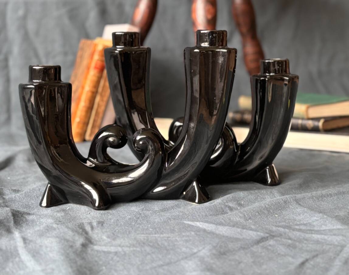 2 black ceramic candle holders