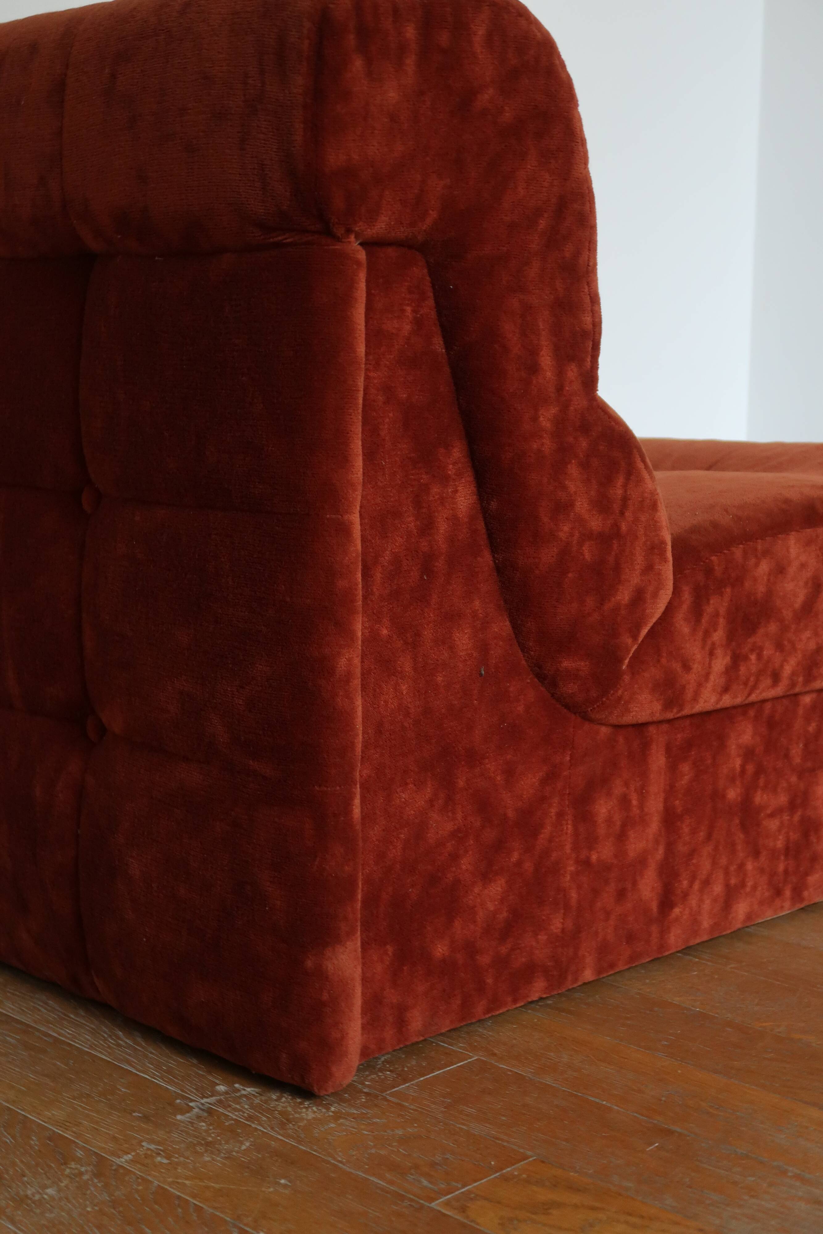 Rusty velvet low chair without arms