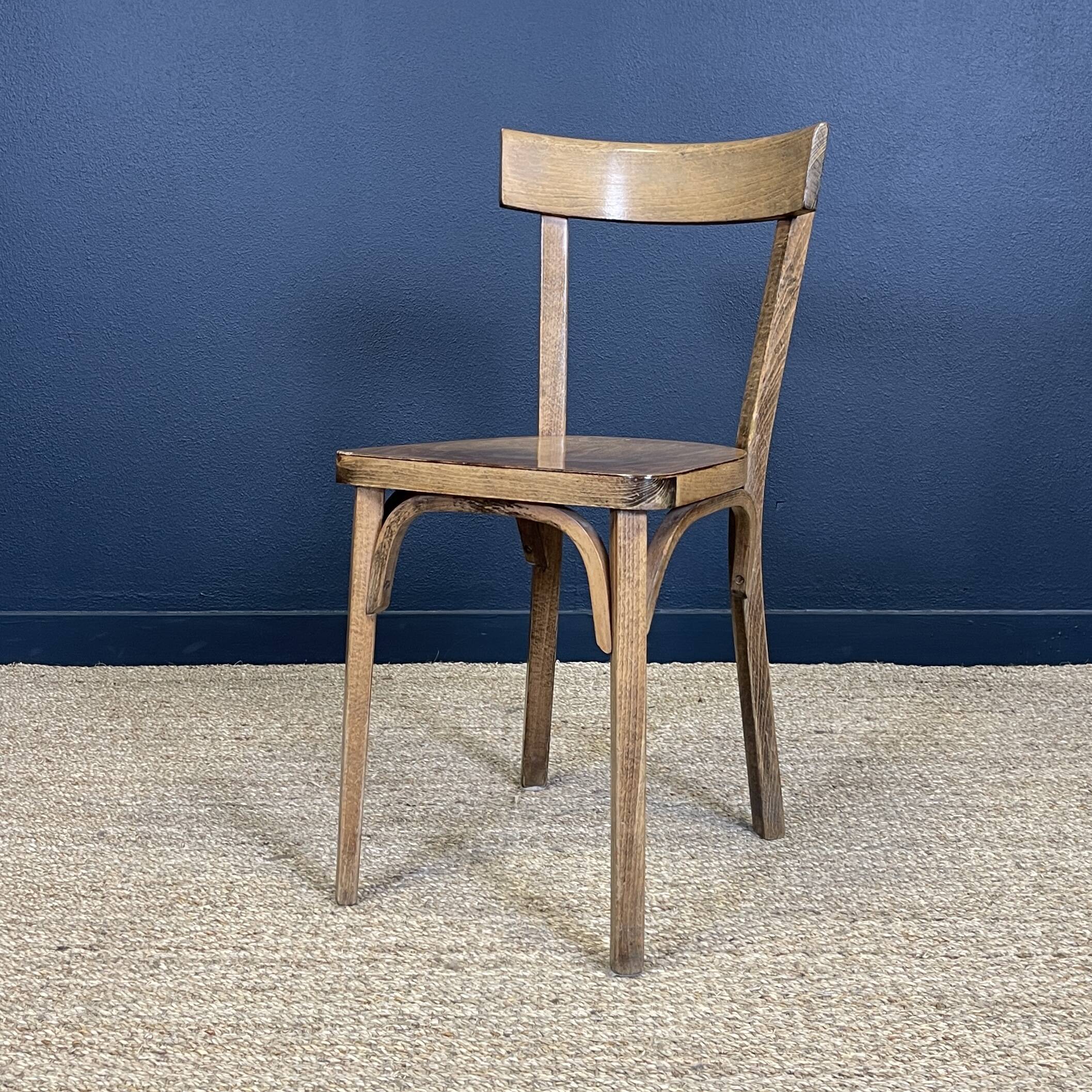Set of 26 Baumann wooden bistro chairs from the 1950s France
