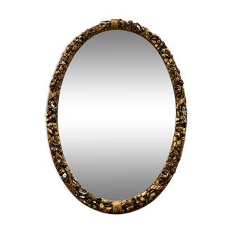 Golden oval mirror